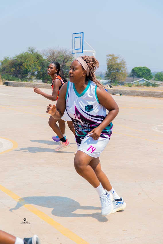Women basketball players running on an outdoor court