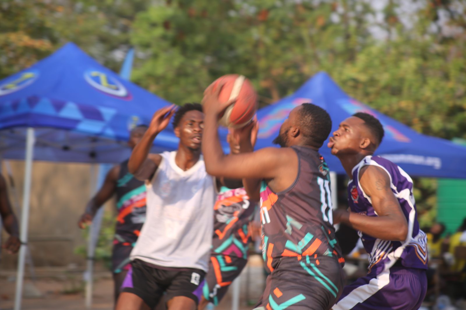 Senior men's league game underway at dusk